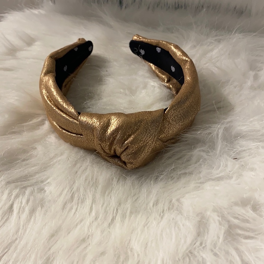 Gold faux leather Lele Sadoughi headband. GUC